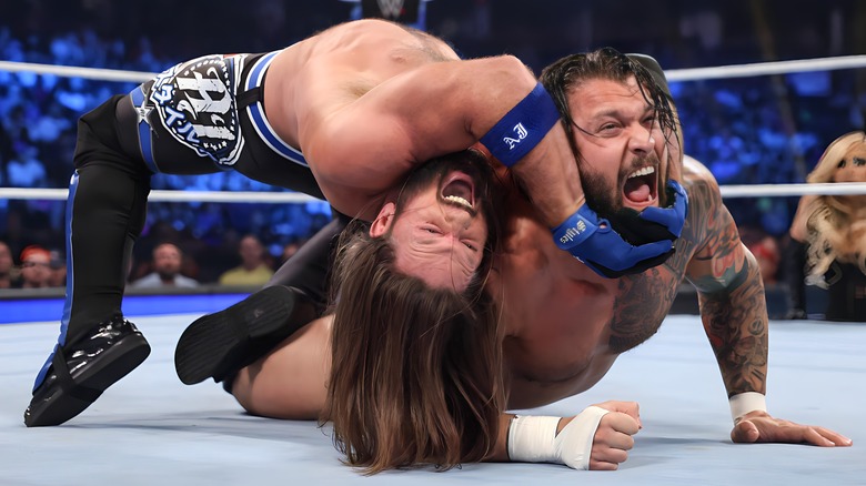 Aj Styles gets Karrion Kross in a submission hold