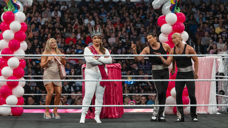 Nia Jax celebrating with Tiffany Stratton and Pretty Deadly