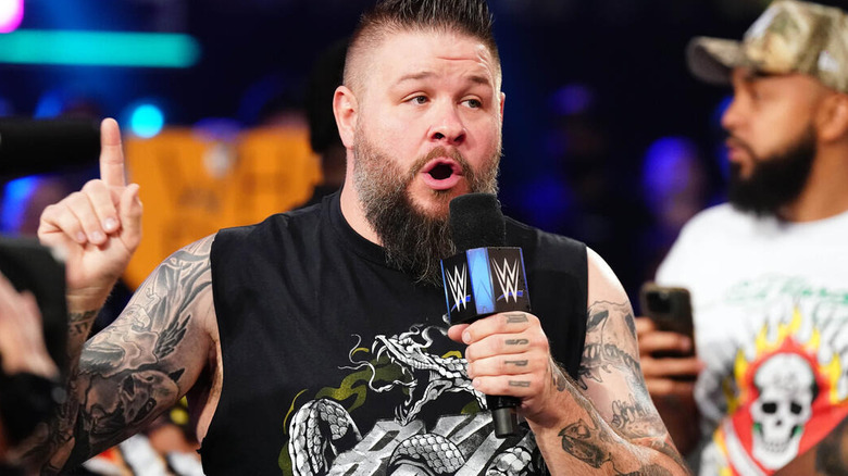 Kevin Owens with a microphone