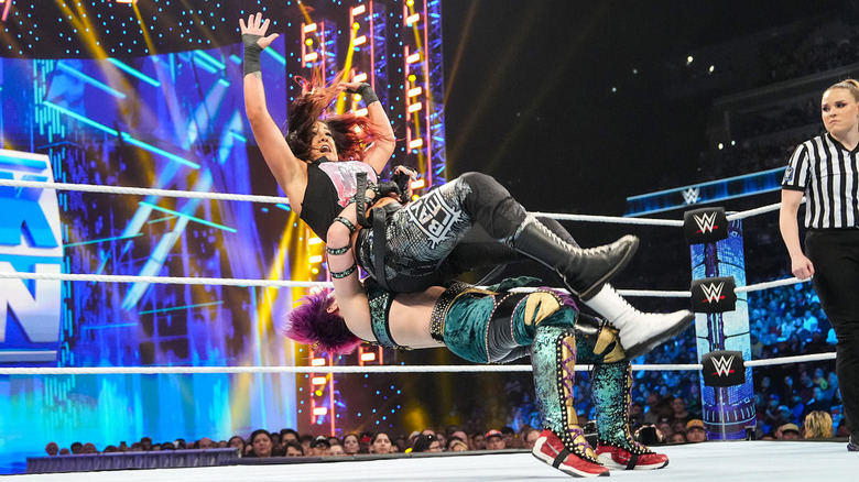 Asuka suplexing Bayley