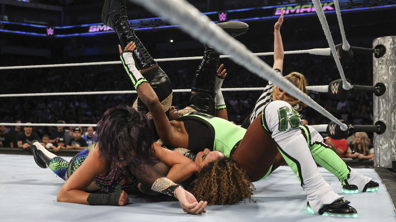 Bayley and Naomi pinning Nia Jax