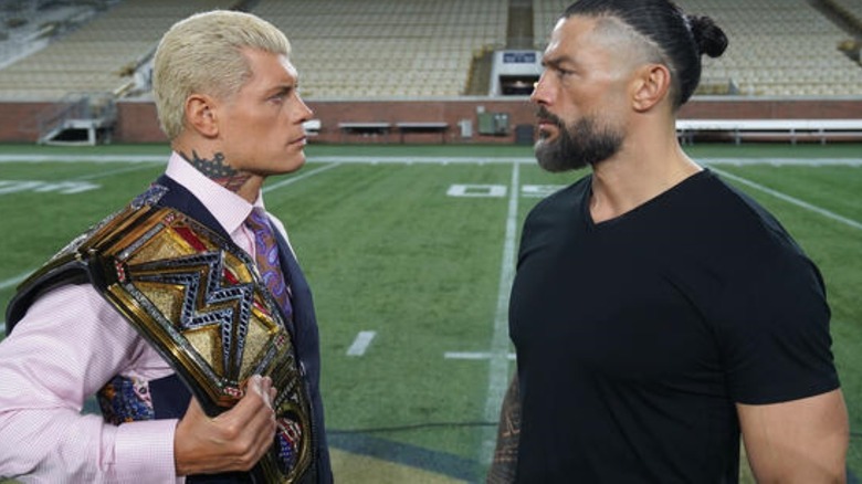 Cody Rhodes and Roman Reigns stare each other down