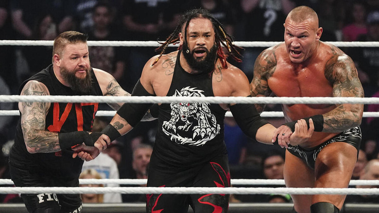 Kevin Owens and Randy Orton attacking Jacob Fatu