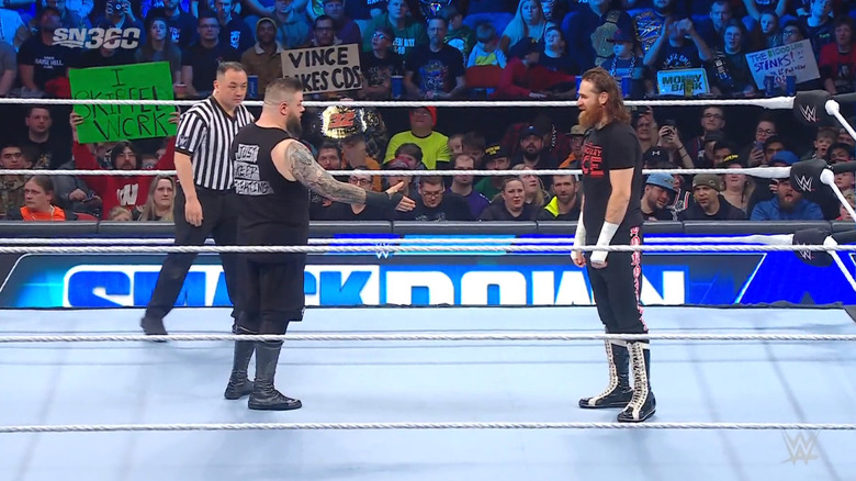 Owens offering his hand to Zayn