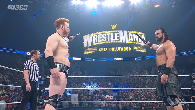 The pair pointing at the WrestleMania sign