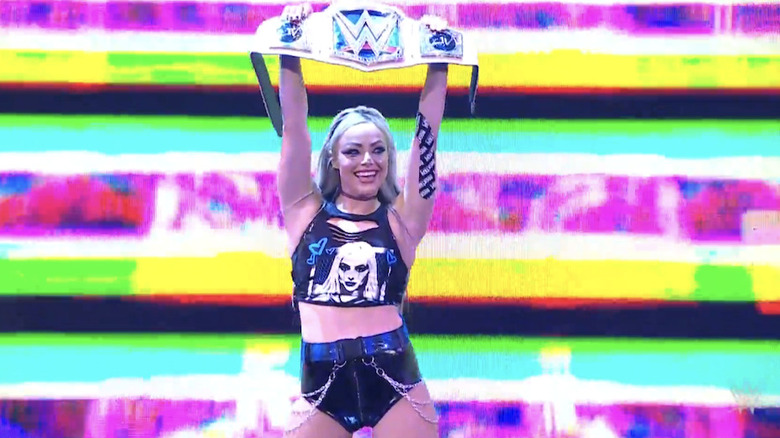 Morgan holding up her title as she heads to the ring