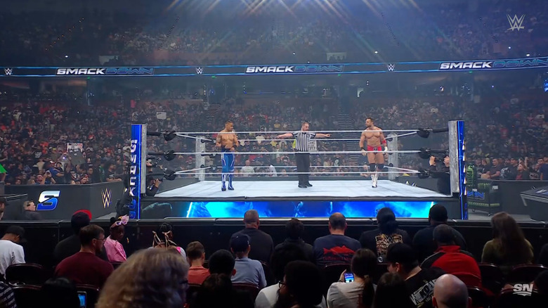 Hayes and Knight staring each other down in the ring