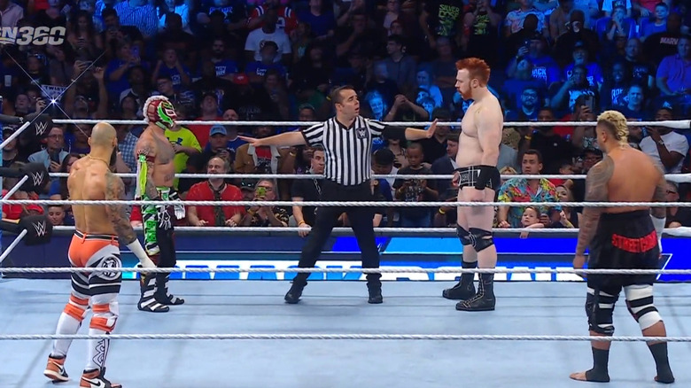 The four men facing off in the ring