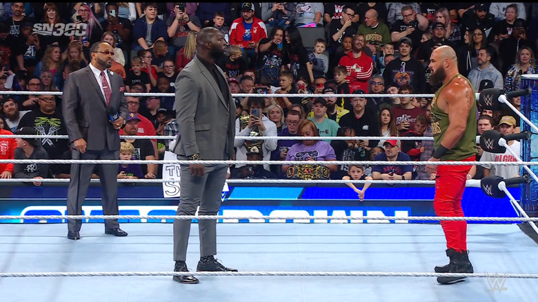 Strowman and Omos stare one another down