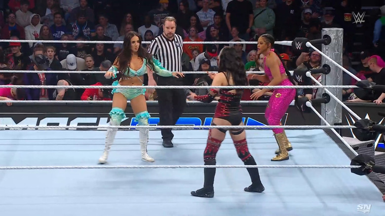 Green, Davenport, and Belair in the ring