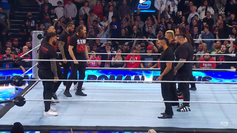 The Bloodline, Reigns, Zayn, and The Usos in the ring