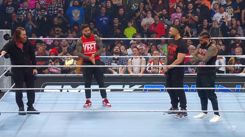 Zayn, Jey, Reigns, and Jimmy in the ring