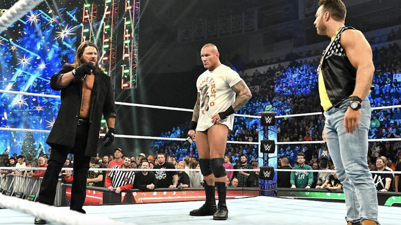 Styles, Orton, and Knight staring one another down