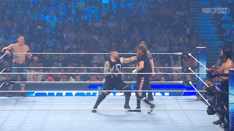 Owens and Zayn battling it out in the ring