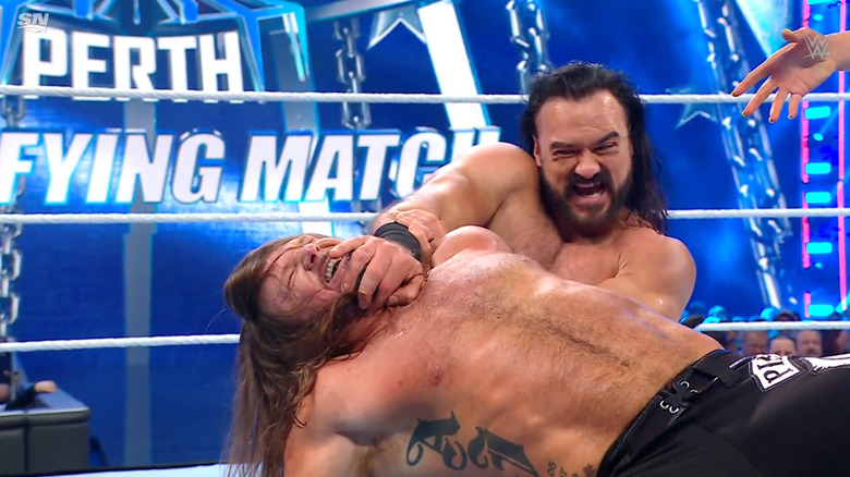 McIntyre with Styles in a submission hold