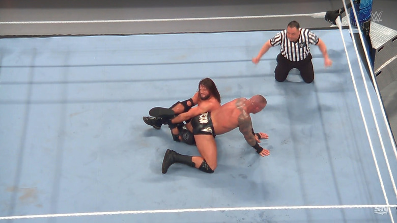 Styles with the Calf Crusher locked in on Orton