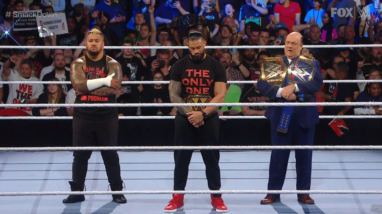 Reigns, Heyman, and Sikoa in the ring