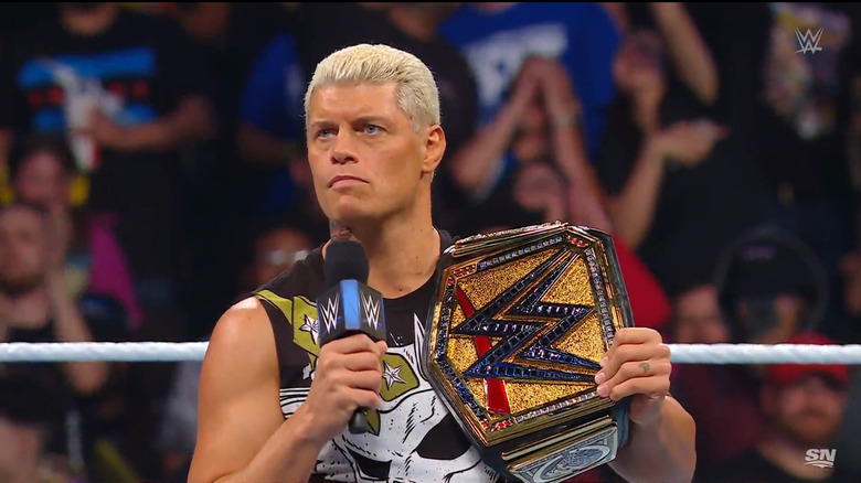 Rhodes in the ring with his title