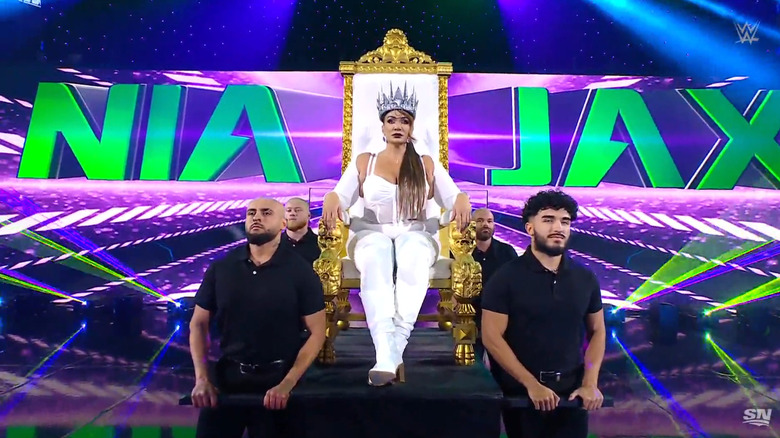 Jax being carried to the ring on a throne