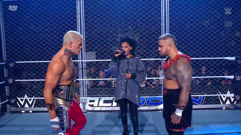 Rhodes and Sikoa staring one another down in the Steel Cage