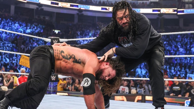 Roman Reigns beats up AJ Styles