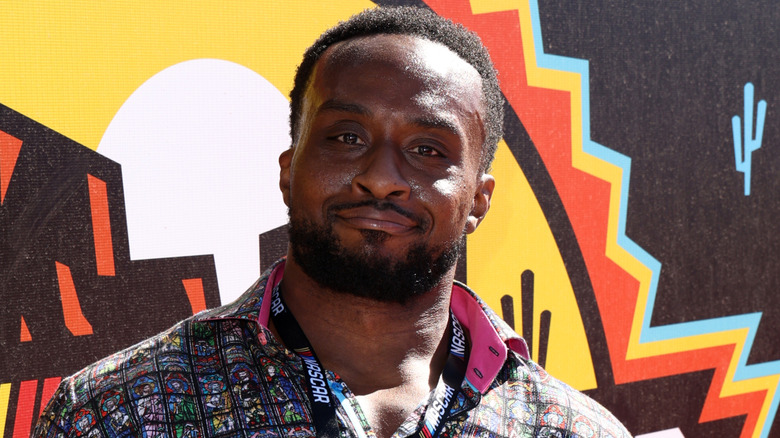 Big E posing for photos at a red carpet event