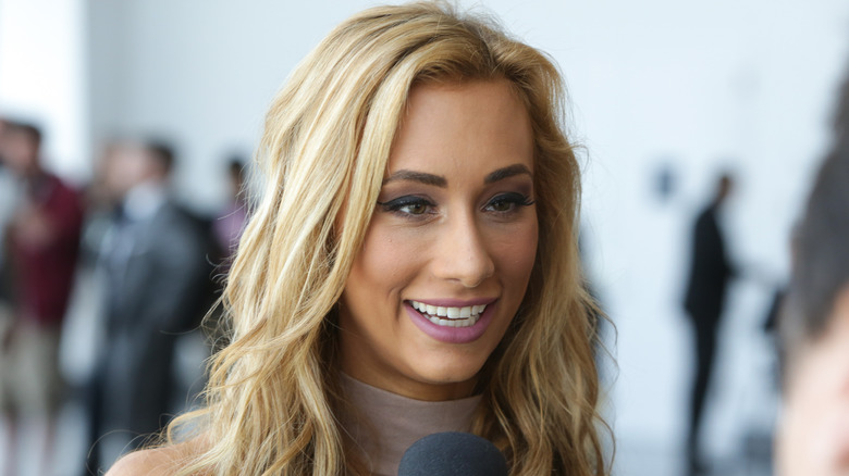 Carmella speaking with the media