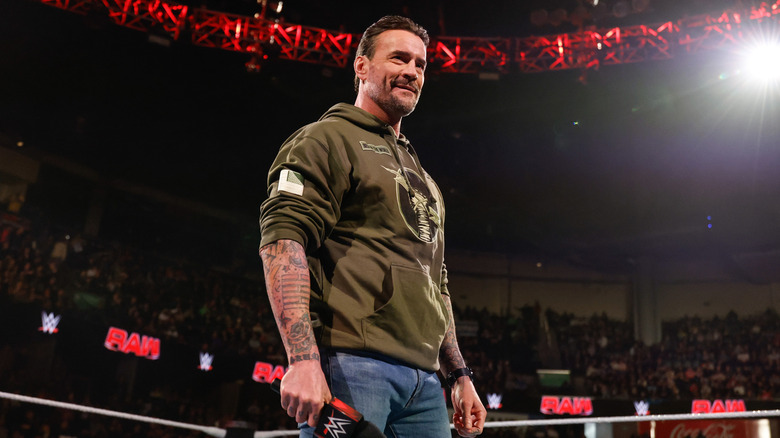 CM Punk holding a microphone