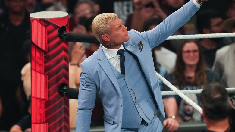 Cody Rhodes points up towards the sky