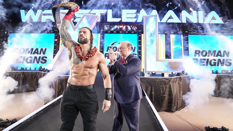 Roman Reigns accompanied by Paul Heyman making his entrance with the Undisputed WWE Championship at WrestleMania