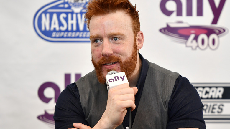 Sheamus holding a microphone