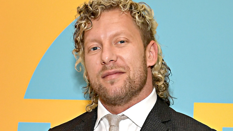 Kenny Omega smirks