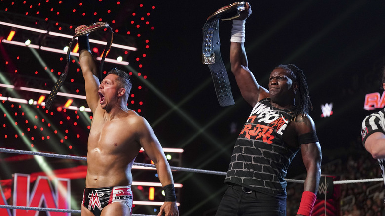 The Miz and R-Truth hold their title belts high