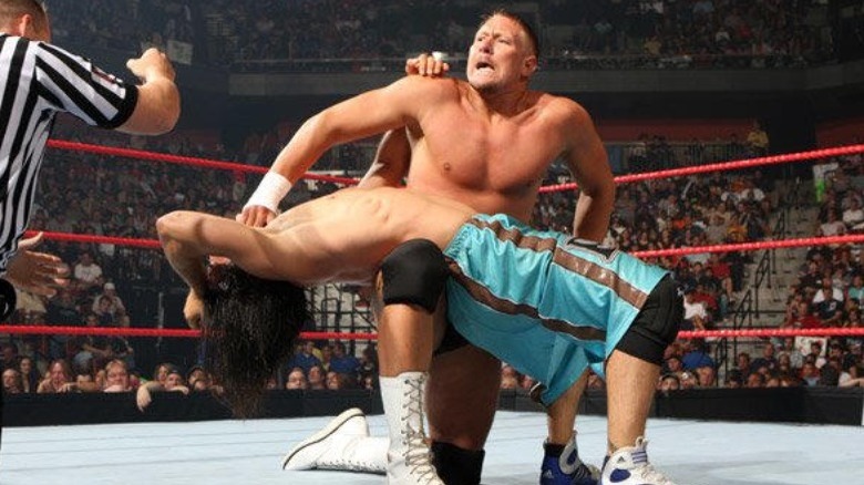 Lance Cade holds a submission