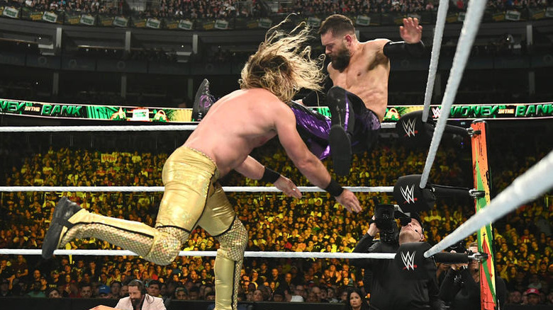 Seth Rollins wrestles Finn Balor