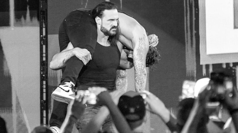 Drew McIntyre with CM Punk on his shoulders