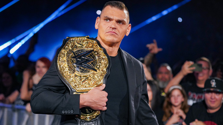 GUNTHER with the World Heavyweight Championship on his shoulder