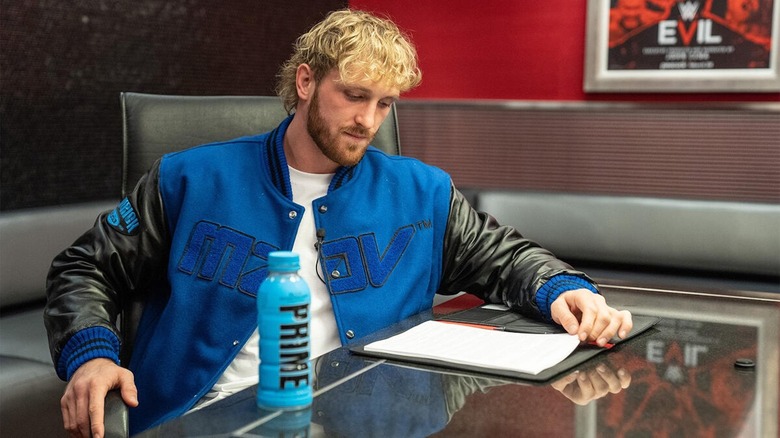 Logan Paul signs his WWE contract.