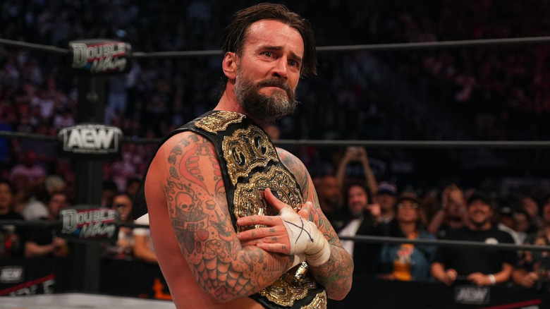 CM Punk looking sad with AEW Title