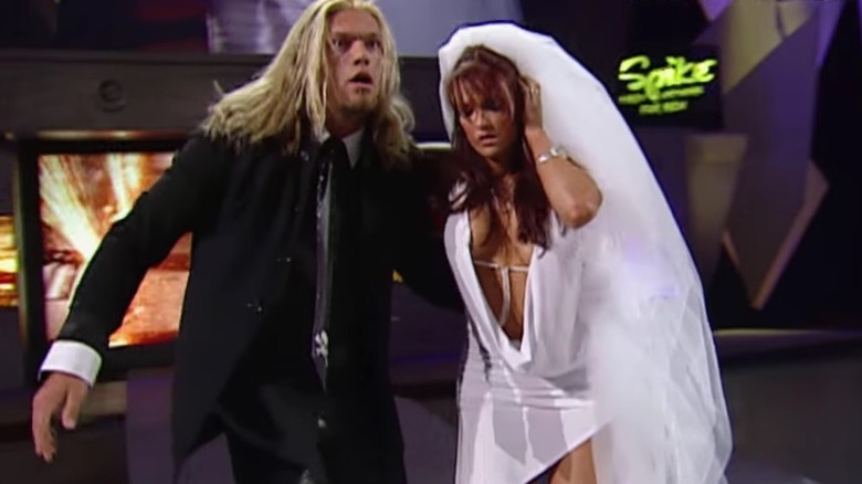 Edge and Lita fleeing the ring