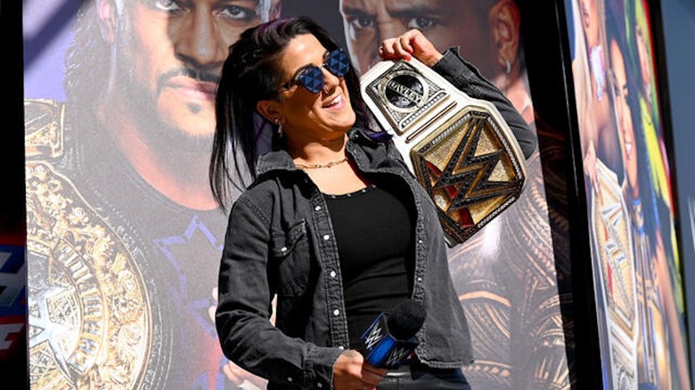 Bayley shows off her WWE Women's Championship.