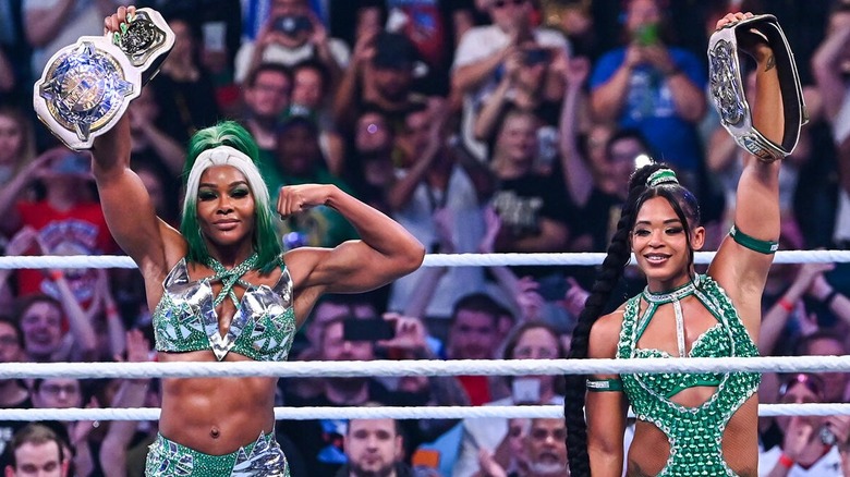 Bianca Belair and Jade Cargill stand victorious after winning the WWE Women's Tag Titles for a second time