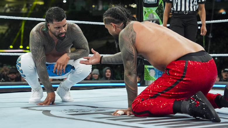 Jimmy Uso reaches out a hand to Jey Uso