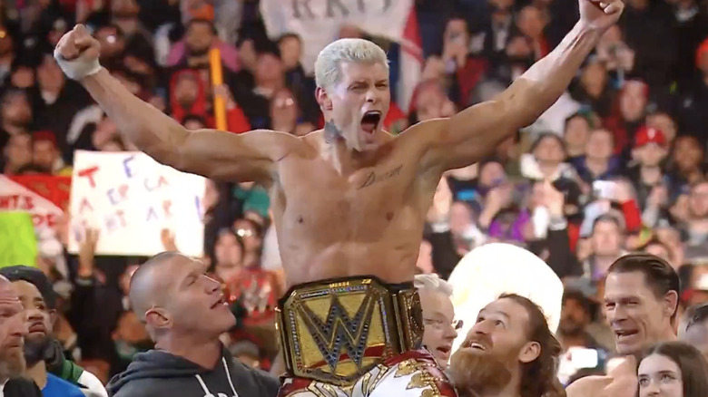 Cody Rhodes celebrates with WWE roster