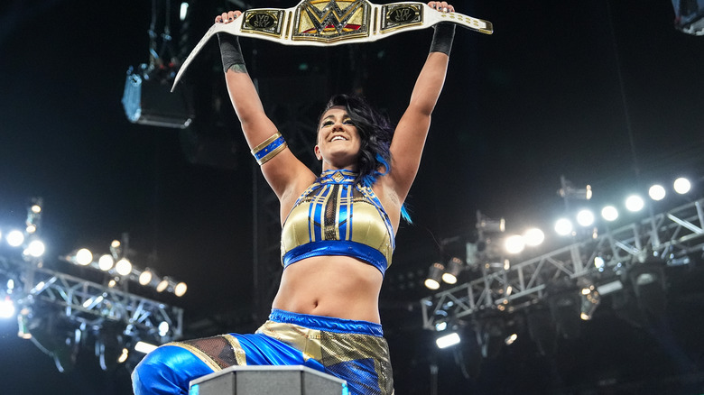 Bayley raises WWE Women's title above her head