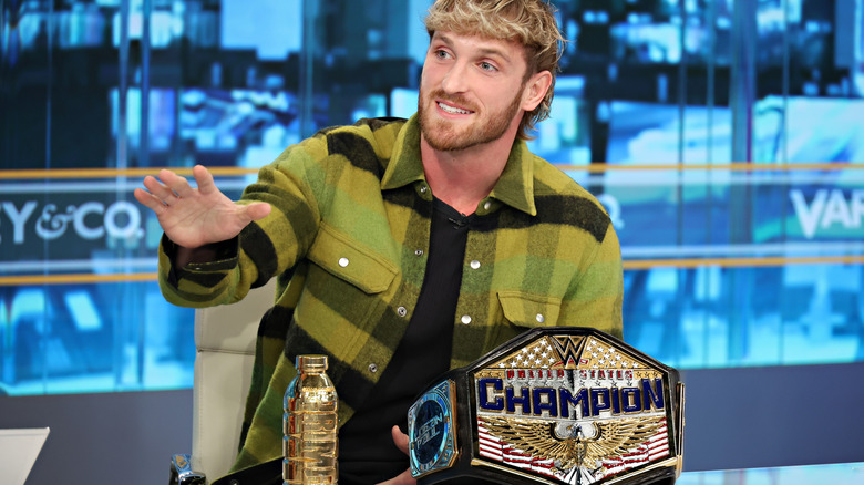 Logan Paul smiling with WWE United States Championship