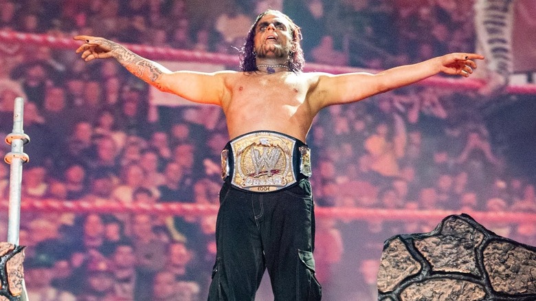 Jeff Hardy wearing the WWE Championship