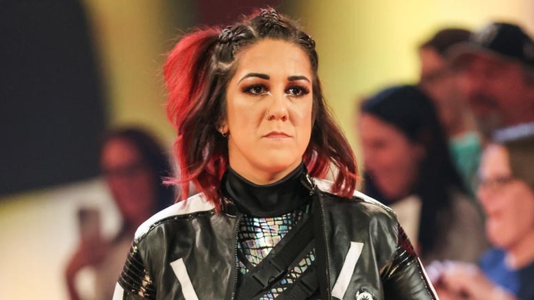 Bayley looking very upset about whatever is going on in the ring