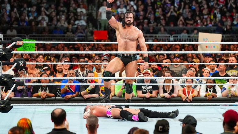 Drew McIntyre stands over a limp CM Punk in the middle of the ring following their match at SummerSlam.