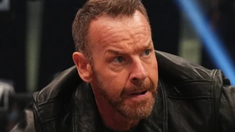 Christian Cage sneakily plots as he looks on 